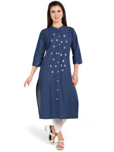 Woman wearing a blue kurta with white patterns on a white background