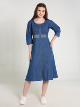 Woman wearing a blue denim dress