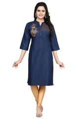 A woman modeling a dark blue denim-style kurta with gold floral embroidery on the chest, paired with tan leggings and beige sandals, against a plain white background.