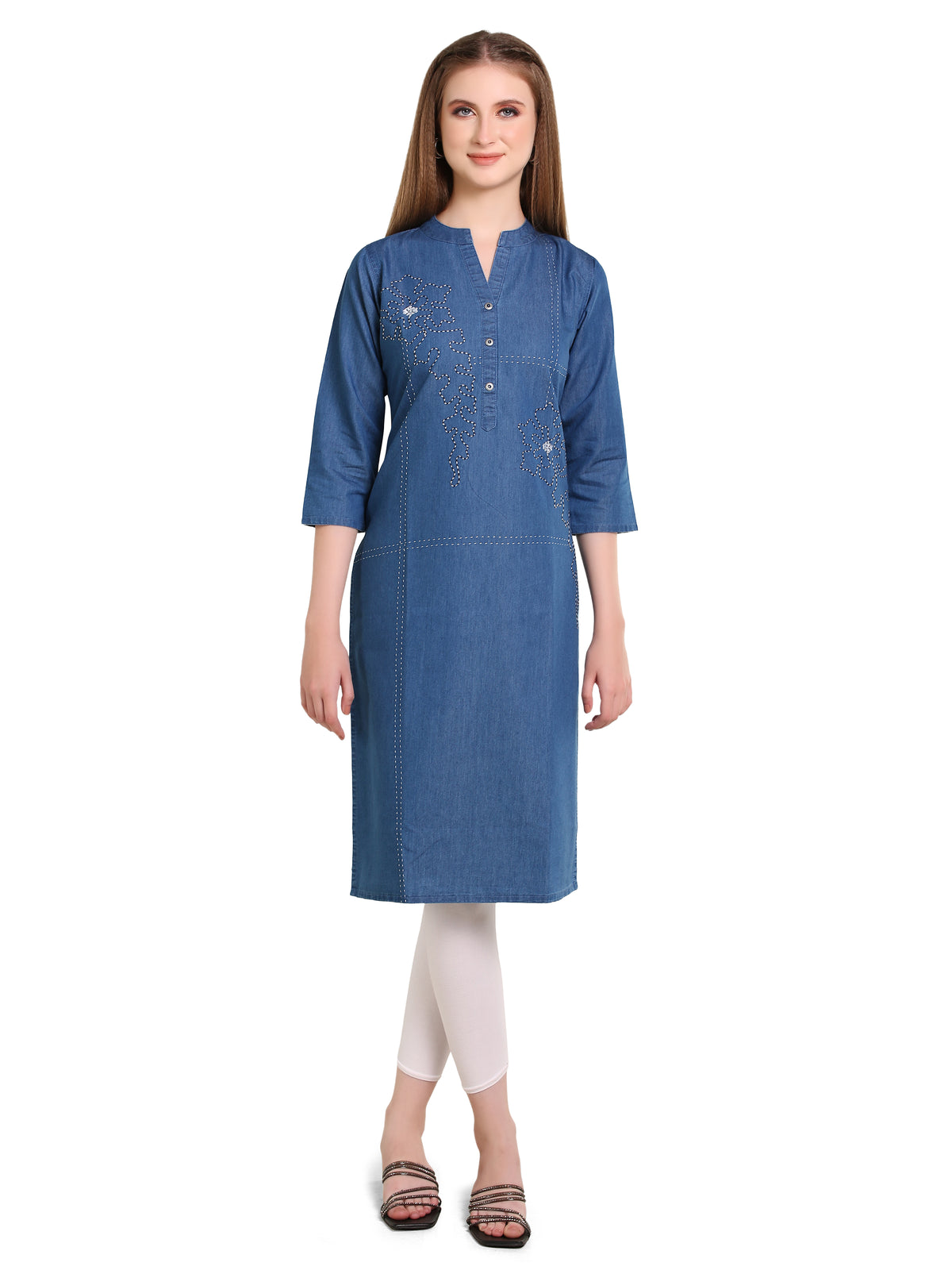 A woman modeling a blue denim-style straight kurta with 3/4 sleeves, a split neckline, and a button placket, paired with white leggings and brown sandals against a plain white background.